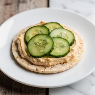 Rice Cake with Hummus and Sliced Cucumbers